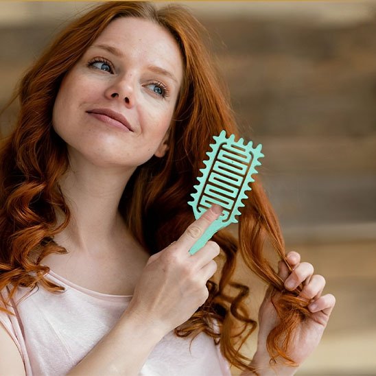 Brosse  à cheveux  bouclés rigide
